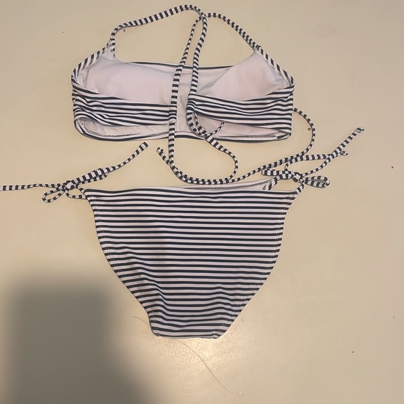 Juniors bikini. Never worn by my daughter. Top says it’s L but its very small. - Picture 2 of 4